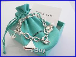 Tiffany & Co Silver Seas Anchor Fish Boat Starfish Charm Bracelet Bangle 7.75 In