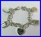 Tiffany-Co-Sterling-Silver-Heart-Charm-Bracelet-With-4-Mini-Lock-Pendants-7-5-01-db