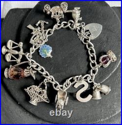 VINTAGE 1975 STERLING SILVER 3D CHARM BRACELET AND CHARMS with HEART CLASP VINTAGE 1975 STERLING SILVER 3D CHARM BRACELET AND CHARMS with HEART CLASP