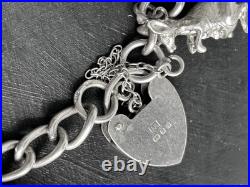 VINTAGE 1975 STERLING SILVER 3D CHARM BRACELET AND CHARMS with HEART CLASP VINTAGE 1975 STERLING SILVER 3D CHARM BRACELET AND CHARMS with HEART CLASP
