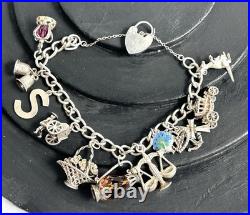 VINTAGE 1975 STERLING SILVER 3D CHARM BRACELET AND CHARMS with HEART CLASP VINTAGE 1975 STERLING SILVER 3D CHARM BRACELET AND CHARMS with HEART CLASP