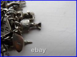Vintage (1960/70s) Silver and White metal Charm Bracelet. 32 charms