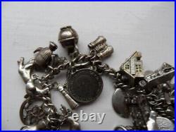 Vintage (1960/70s) Silver and White metal Charm Bracelet. 32 charms