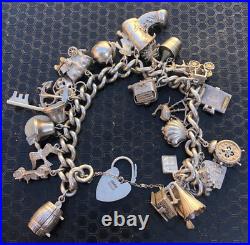 Vintage 1970's Silver 25x piece charm bracelet inc NUVO ice bucket padlock 101g