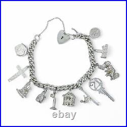 Vintage 1973 sterling silver charm bracelet, 11 charms and heart padlock, bear