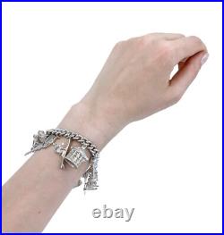 Vintage 1973 sterling silver charm bracelet, 11 charms and heart padlock, bear