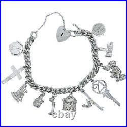 Vintage 1973 sterling silver charm bracelet, 11 charms and heart padlock, bear