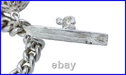 Vintage 1973 sterling silver charm bracelet, 11 charms and heart padlock, bear