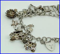 Vintage 1976 English Sterling Silver Heavy Charm Bracelet 7 + 21 Charms 61g