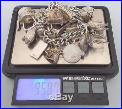 Vintage 6.5'' solid silver charm bracelet 21 charms, G. J. Ltd, London (95.78g)