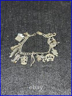 Vintage 7 1/4 Inch Long. 925 Sterling Silver Multiple Charm Bracelet