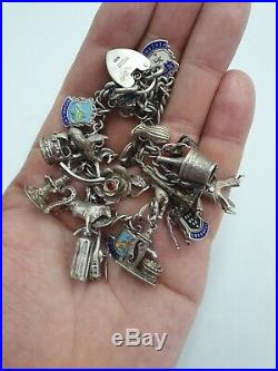 Vintage Antique Sterling Silver Charm Bracelet with 24 Silver Charms. 63 grams