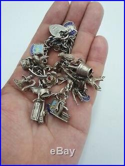 Vintage Antique Sterling Silver Charm Bracelet with 24 Silver Charms. 63 grams