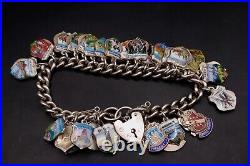 Vintage English Sterling Silver 7 Charm Bracelet With 50 Enamel Shield Charms
