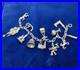 Vintage-German-835-Sterling-Silver-Charm-Bracelet-12-Charms-7-3-8-in-Length-01-epvo