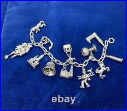 Vintage German 835 Sterling Silver Charm Bracelet 12 Charms 7 3/8 in Length Vintage German 835 Sterling Silver Charm Bracelet 12 Charms 7 3/8 in Length