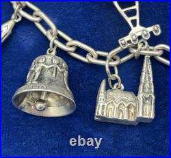 Vintage German 835 Sterling Silver Charm Bracelet 12 Charms 7 3/8 in Length Vintage German 835 Sterling Silver Charm Bracelet 12 Charms 7 3/8 in Length
