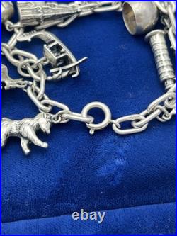 Vintage German 835 Sterling Silver Charm Bracelet 12 Charms 7 3/8 in Length Vintage German 835 Sterling Silver Charm Bracelet 12 Charms 7 3/8 in Length