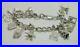 Vintage-Heavy-Solid-Silver-Curb-Bracelet-With-11-Silver-Charms-01-puwi
