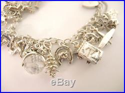 Vintage Heavy Sterling Silver Charm bracelet 30 plus charms 49grams