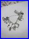 Vintage-Silver-16-Charms-Bracelet-60s-70s-Style-Hinged-And-Interactive-Charms-01-imcg
