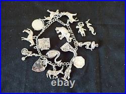 Vintage Silver Charm Bracelet with 15 charms bible swan pixie piano horse dog