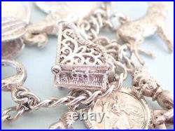 Vintage Silver Charm Bracelet with 15 charms bible swan pixie piano horse dog