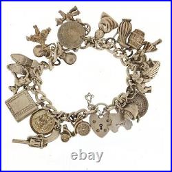 Vintage Silver charm bracelet with silver charms Dated 1976 C, 75.0g