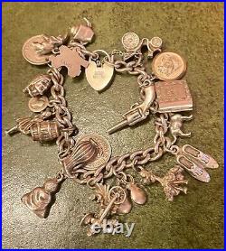 Vintage Silver charm bracelet with silver charms Dated 1976 C, 75.0g