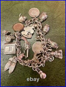 Vintage Silver charm bracelet with silver charms Dated 1976 C, 75.0g