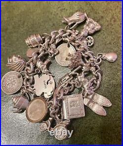 Vintage Silver charm bracelet with silver charms Dated 1976 C, 75.0g