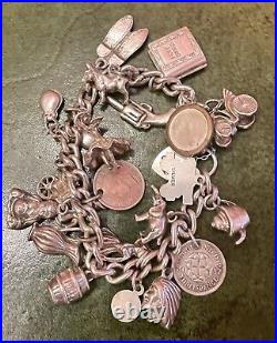 Vintage Silver charm bracelet with silver charms Dated 1976 C, 75.0g