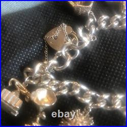 Vintage Solid Silver Charm Bracelet & 10 Different Charms Vgc