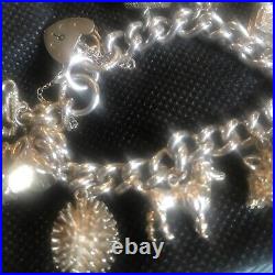 Vintage Solid Silver Charm Bracelet & 10 Different Charms Vgc