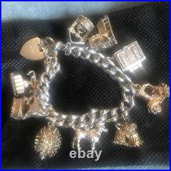 Vintage Solid Silver Charm Bracelet & 10 Different Charms Vgc