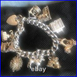 Vintage Solid Silver Charm Bracelet & 10 Different Charms Vgc