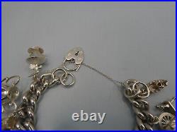 Vintage Solid Silver Charm Bracelet 114 Grams 11 Charms Some Rare