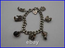 Vintage Solid Silver Charm Bracelet 58 Grams 7 Charms Some Rare