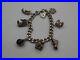 Vintage-Solid-Silver-Charm-Bracelet-58-Grams-7-Charms-Some-Rare-01-vf