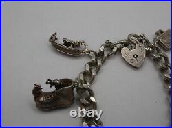 Vintage Solid Silver Charm Bracelet 58 Grams 7 Charms Some Rare