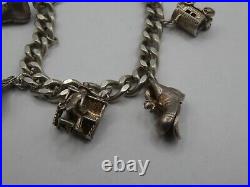 Vintage Solid Silver Charm Bracelet 58 Grams 7 Charms Some Rare