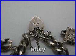 Vintage Solid Silver Charm Bracelet 58 Grams 7 Charms Some Rare