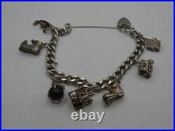 Vintage Solid Silver Charm Bracelet 58 Grams 7 Charms Some Rare