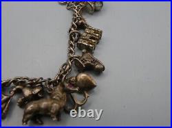 Vintage Solid Silver Charm Bracelet 67 Grams 16 Charms Some Rare