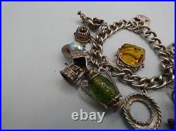 Vintage Solid Silver Charm Bracelet 78 Grams 11 Charms Some Rare 1970