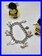 Vintage-Solid-Silver-Charm-Bracelet-with-Heart-Padlock-6-Animal-Charms-01-oy