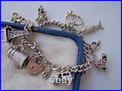 Vintage Solid Sterling Silver Charm Bracelet 11 Rare Charms Paddlock Heavy 48.2