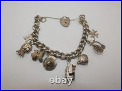 Vintage Solid Sterling Silver Charm Bracelet 54 Grams 8 Charms Some Rare