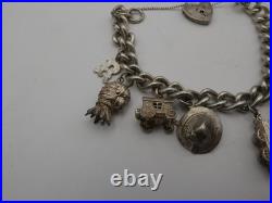 Vintage Solid Sterling Silver Charm Bracelet 54 Grams 8 Charms Some Rare