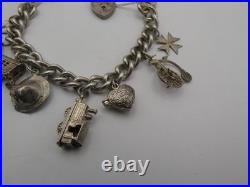Vintage Solid Sterling Silver Charm Bracelet 54 Grams 8 Charms Some Rare